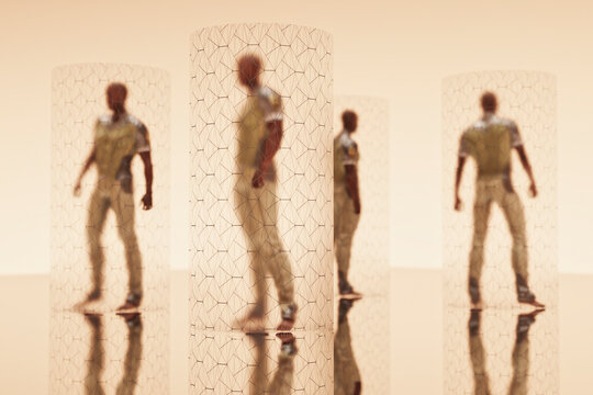 Men inside glass cylinders