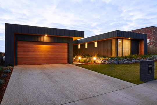 Exterior of architect designed luxury home at twilight