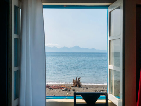 View from window at scenic seaside on summer day