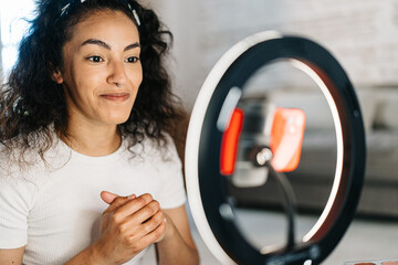 Beauty blogger recording video of makeup procedure