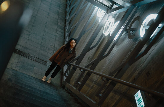 Girl Looking At The Camera In The Button Of Stair