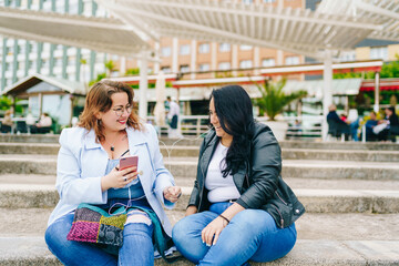 Two plus size girls listen to music