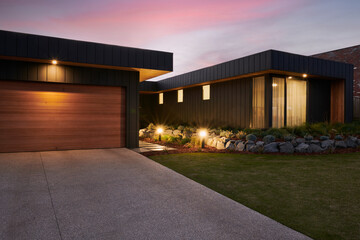 Exterior of architect designed luxury home at twilight