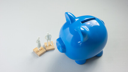 The blue piggy bank on white background for saving or business concept