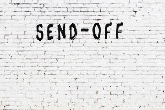 Inscription send-off painted on white brick wall