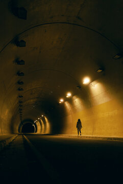 Girl Alone Walking Tunnel At Night