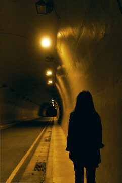 Girl Alone Walking Tunnel At Night