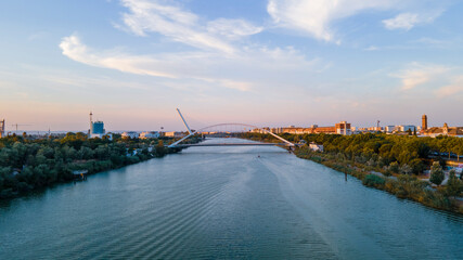 Fototapeta premium Aerial View of Guadalquivir River in Seville with Barqueta and Alamillo Bridges