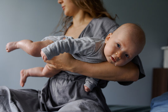 portrait of a newborn on  background in the hands 