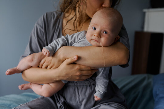 portrait of a newborn on  background in the hands 