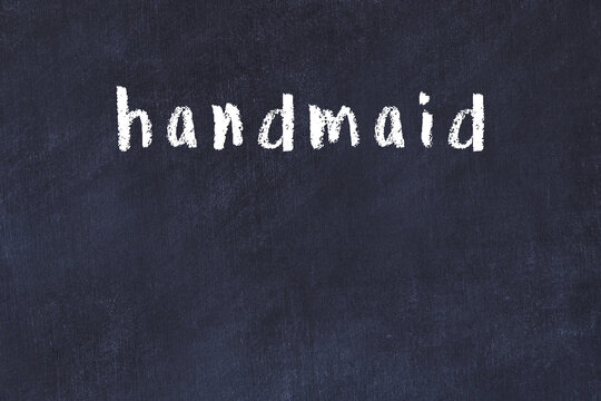 Black chalkboard with inscription handmaid on in