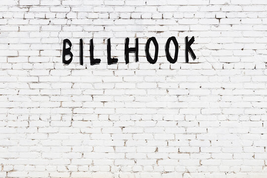 Inscription billhook painted on white brick wall