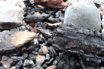 fire wood charred rocks, stones 