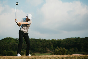 Golfers take the swing shot with a strong stance.