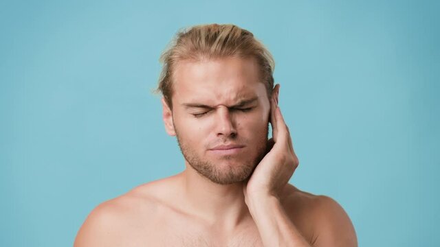 Ear Pain. Sick Young Man Suffering From Otitis Illness, Rubbing Sore Auricle