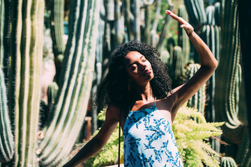 Woman with a straw hat in a beautiful garden