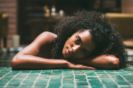 Woman leaning in a mosaic floor