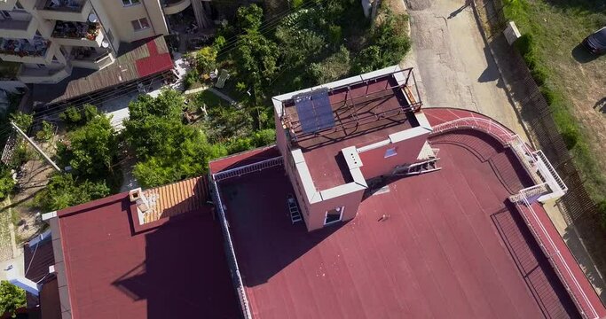 Drone Circling video of the red roof with solar panels, south of Bulgaria. Alternative energy concept.
