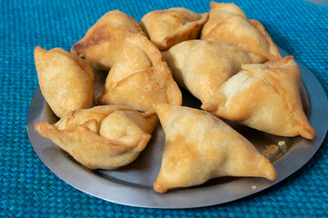 Homemade Samosa, samsa or smosa. A vegetarian spicy Indian special traditional street food. Iftaari dish, Selective focus.