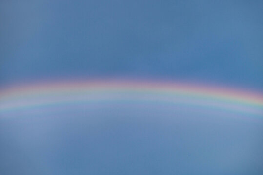 rainbow on blue sky background