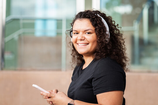 Young Woman Listening To Podcast
