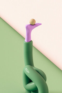 Abstract leg doing yoga with a wooden sphere