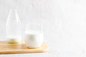 glass of milk and bottle of milk