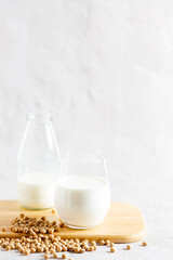 glass of soy milk and bottle
