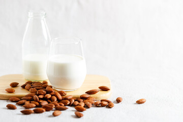 glass of almond milk and bottle