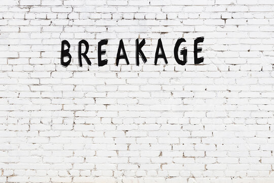 White wall with black paint inscription breakage on it