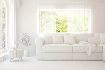 Fototapeta premium Mock up of stylish room in white color with sofa and green landscape in window. Scandinavian interior design. 3D illustration