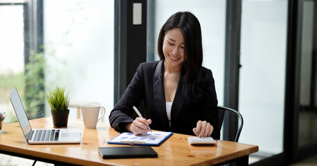 Business woman accountant working with computer and calculator for business and financial expense....
