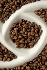 Coffee beans in textured  plate. Roasted coffee beans.Morning traditional  drink. Coffee beans texture.Invigorating drink ingredients 