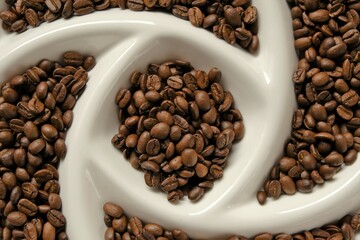Roasted coffee beans.Arabica coffee. Morning traditional  drink. Coffee beans texture.Invigorating drink ingredients 