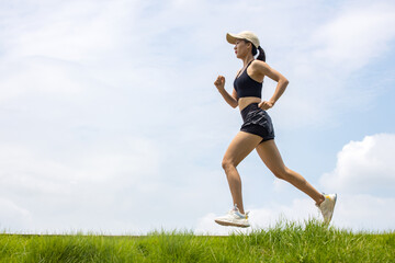 Young Asian girls running in the morning for fitness