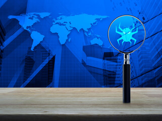 Virus computer icon with magnifying glass on wooden table over world map, modern city tower and skyscraper, Technology internet security concept, Elements of this image furnished by NASA