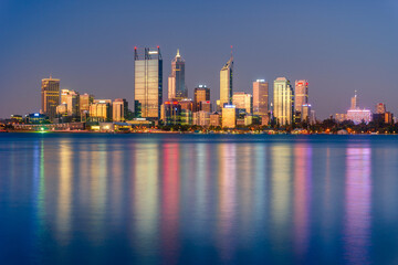 Fototapeta na wymiar Sunset view of Perth city buildings and the Swan River seen from Mill Point. The modern city of Perth is the state capital of Western Australia, Australia.