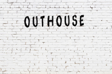 Inscription outhouse painted on white brick wall - obrazy, fototapety, plakaty