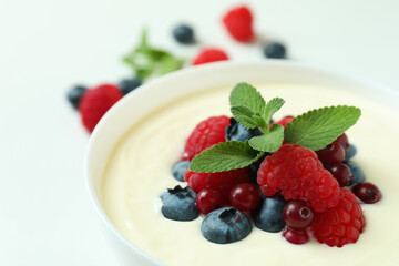 Concept of tasty breakfast with yogurt on white background