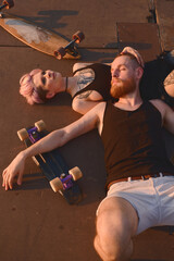 Hipster skater couple hanging out together outdoor