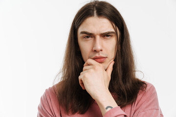 Portrait of a young white casual man with long brown hair