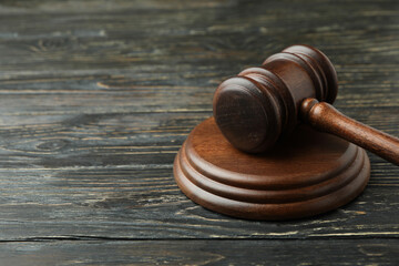 Judge gavel on rustic wooden background, space for text