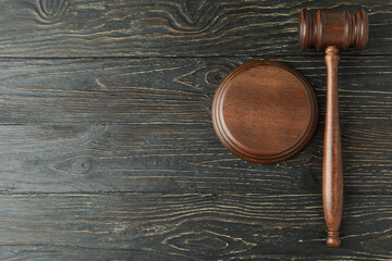 Judge gavel on rustic wooden background, space for text