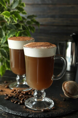 Concept of delicious drink with Irish coffee on wooden table