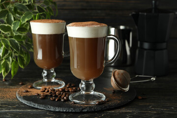 Concept of delicious drink with Irish coffee on wooden table