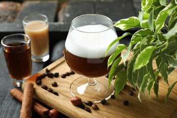 Concept of delicious drink with Irish coffee on wooden board