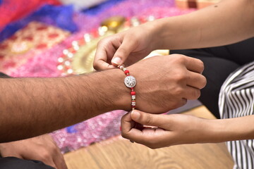Sister Binding Rakhi On Brother Hand, Raksha Bandhan Occasion