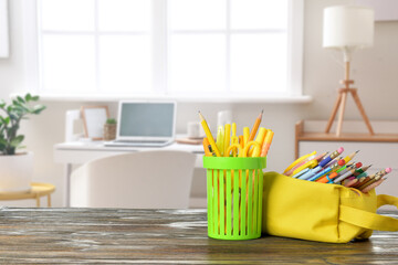Set of school supplies on table at home