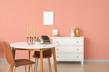 Aroma candles and books on table in room