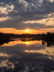 sunset over forest lake